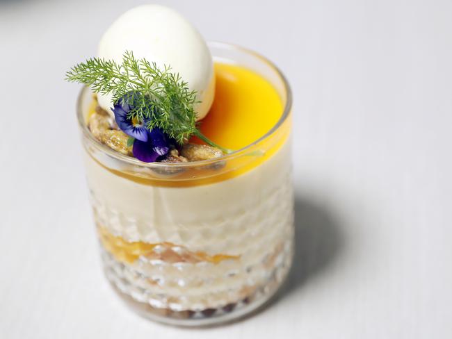 Mango Cremeaux trifle with poached peach, passionfruit jelly and sorbet with crystallised pistachios at Bistro C in Noosa. Photo Lachie Millard