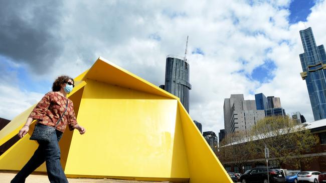 A lone pedestrian walks past the Yellow Peril sculpture at South Melbourne in 2020. Picture: NCA NewsWire / Andrew Henshaw