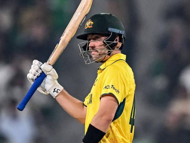 Australia's Josh Inglis celebrates after scoring a half-century (50 runs) during the ICC Champions Trophy one-day international (ODI) cricket match between Australia and England at the Gaddafi Stadium in Lahore on February 22, 2025. (Photo by Aamir QURESHI / AFP)