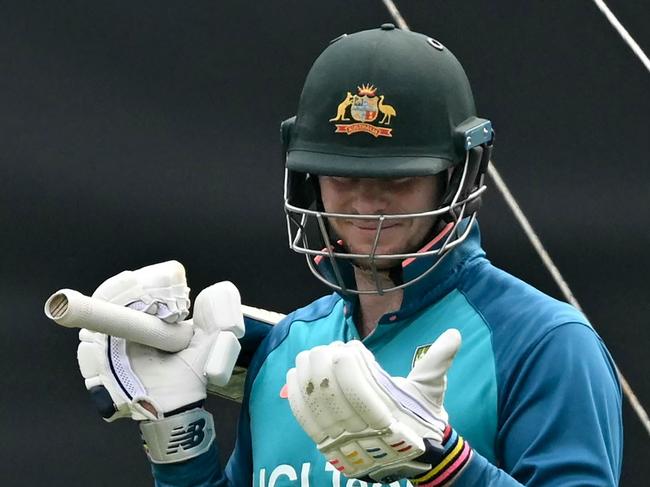 Australia's Steve Smith looks at his gloves during a practice session on the eve of their 2023 ICC Men's Cricket World Cup one-day international (ODI) match against Afghanistan at the Wankhede Stadium in Mumbai on November 6, 2023. (Photo by Indranil MUKHERJEE / AFP) / -- IMAGE RESTRICTED TO EDITORIAL USE - STRICTLY NO COMMERCIAL USE --