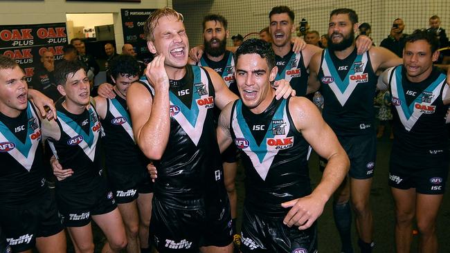 Billy Frampton and Joel Garner sing the Port Adelaide song for the first time. Picture: Mark Brake/Getty Images