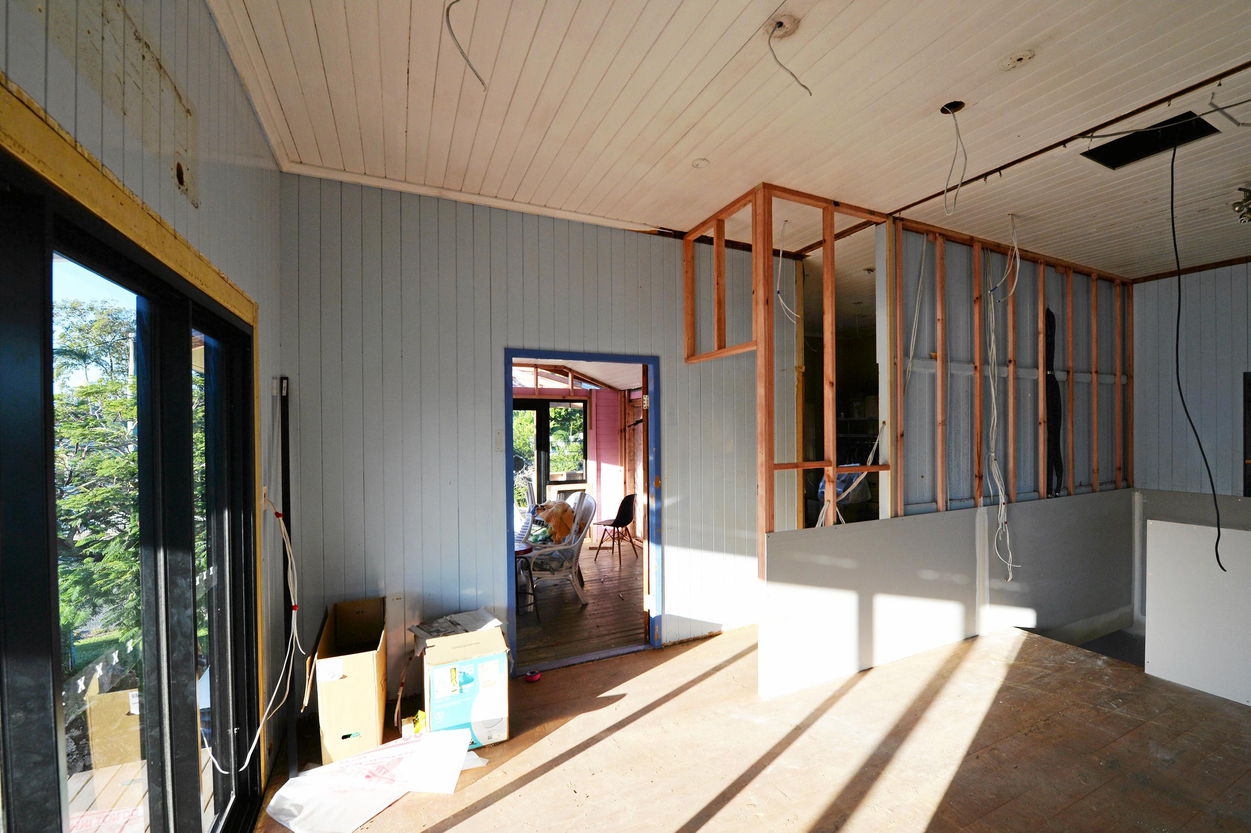 Mackay house-flippers Madison Strutynski and Michael Cotter at their Hunter St, West Mackay property. Picture: Stuart Quinn