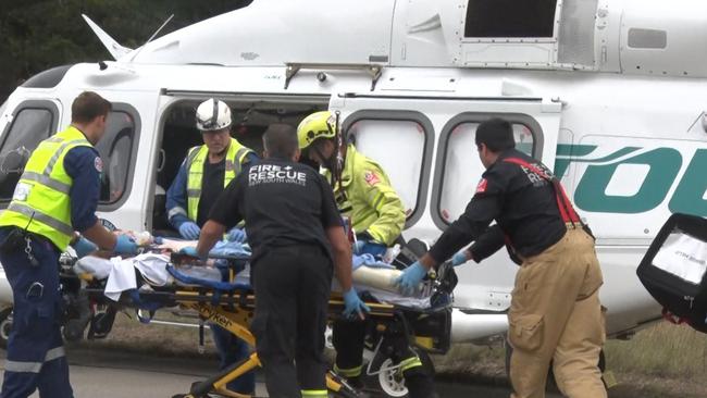 Emergency workers load a patient onto a rescue helicopter. Picture: TNV