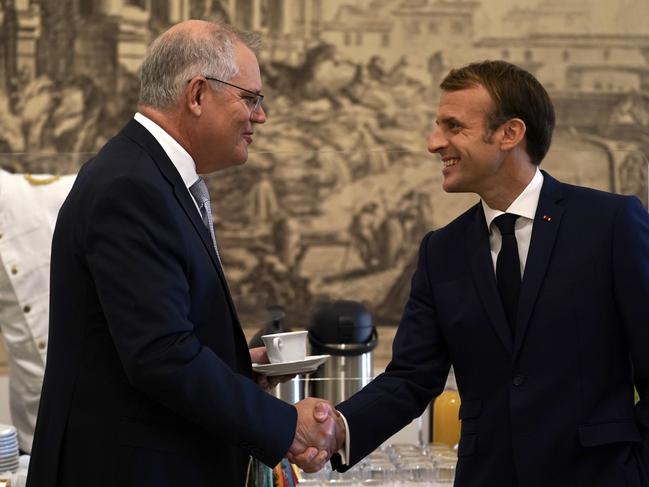 Australian Prime Minister Scott Morrison and French President Emmanuel Macron talk before the G20 leaders make a short visit to the Fontana di Trevi. Picture: Adam Taylor