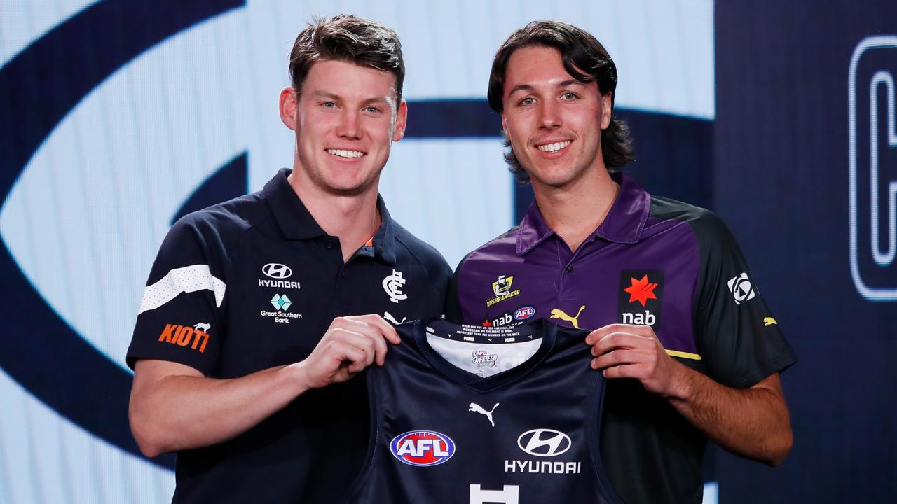 Sam Walsh presents Oliver Hollands his jumper at last week’s draft. Picture: Dylan Burns/AFL Photos