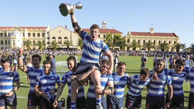 Get around them — Nudgee captain Harry Vella with the GPS trophy. Picture Mark Cranitch.