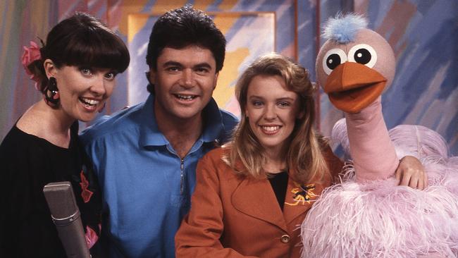 Kylie Minogue with hosts Jacki MacDonald and Daryl Somers on Hey Hey It's Saturday, around 1988.