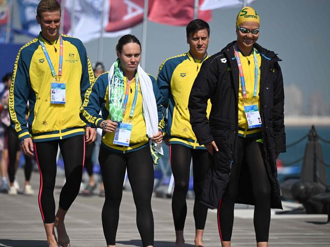 Team Australia arrives for the final of the mixed 4X1500m relay open water swimming event during the 2024 World Aquatics Championships at Doha Port in Doha on February 8, 2024. (Photo by Oli SCARFF / AFP)