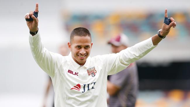 Usman Khawaja of QLD smiles at warm up during day 1 of the Round 5 JLT Sheffield Shield match between Queensland and Victoria at The Gabba in Brisbane, Tuesday, November 27, 2018. (AAP Image/Jono Searle) NO ARCHIVING, EDITORIAL USE ONLY, IMAGES TO BE USED FOR NEWS REPORTING PURPOSES ONLY, NO COMMERCIAL USE WHATSOEVER, NO USE IN BOOKS WITHOUT PRIOR WRITTEN CONSENT FROM AAP