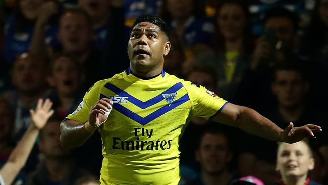 Chris Sandow of Warrington Wolves looks on.