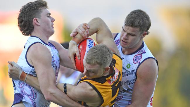 James Worpel is wrapped up in a tackle by his Fremantle opponents. Picture: Getty Images