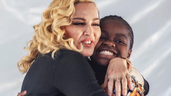 Madonna hugs her Malawian adopted daughter Mercy James. Picture: AFP