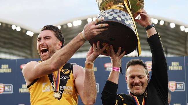 Glenelg coach Darren Reeves (right) and captain Liam McBean celebrate after winning last year’s SANFL grand final at Adelaide Oval. Picture: David Mariuz/SANFL