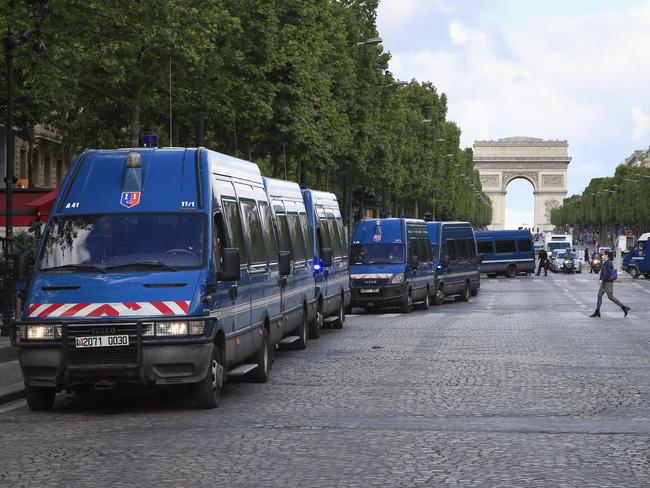 French police cars line up on Champs Elysees avenue in Paris. Picture: AP