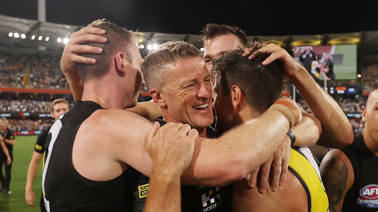 Damien Hardwick hugs his players after the 2020 grand final. Picture: Michael Klein