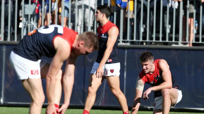 Melbourne players show their pain on the final siren of last year’s preliminary final. Picture: Michael Klein.