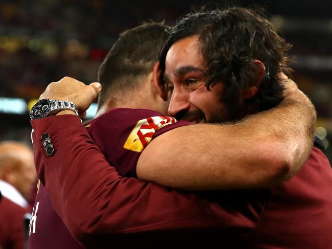 BRISBANE, AUSTRALIA - JULY 12: Cameron Smith of the Maroons embraces injured team mate Johnathan Thurston after winning game three of the State Of Origin series between the Queensland Maroons and the New South Wales Blues at Suncorp Stadium on July 12, 2017 in Brisbane, Australia.  (Photo by Cameron Spencer/Getty Images)