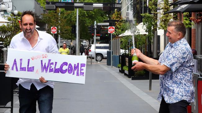 Welcoming back people to Geelong is Gorge Camorra and Bill Votsaris. Picture: Alison Wynd