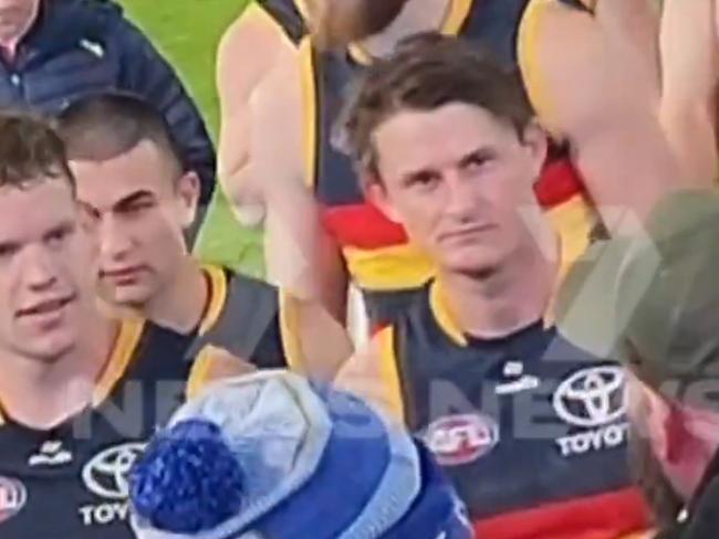 The video showing the alleged incident of Matt Crouch knocking off a football fans hat after the Showdown. Picture: 7NEWS