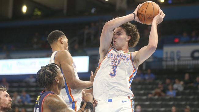 Josh Giddey #3 of the Oklahoma City Thunder grabs a rebound during the first quarter against the Adelaide 36ers