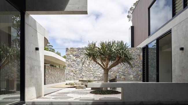 The driving force in excluding turf from this Toowoomba property was to have a low-maintenance garden, but one that complemented the striking Shaun Lockyer-designed house that channels a mid-century vibe. Picure: Scott Burrows