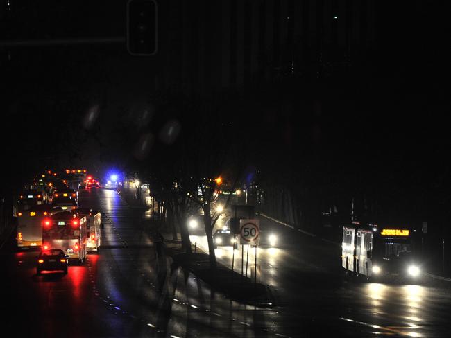 Traffic in total darkness around the CBD in Adelaide after the power network collapsed. Picture: AAP