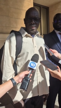 Atem Kuany's father, Elijah Kuany speaks to media outside court