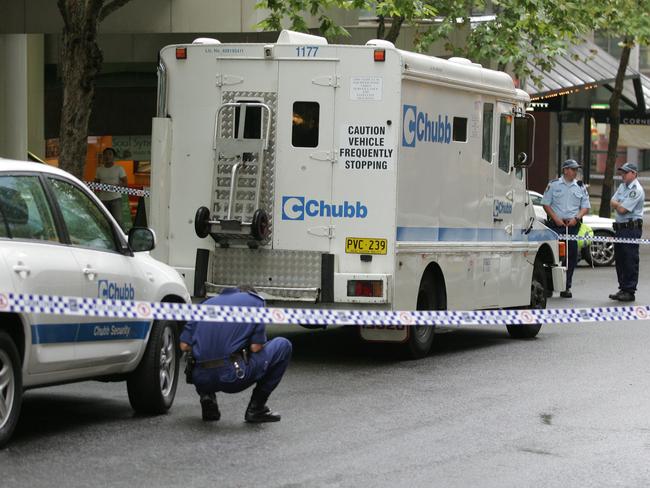 Police investigate the Chubb armoured van robbery in North Sydney in 2009.