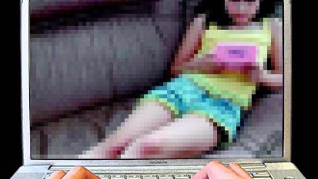 17/04/2009: 17/04/2009: child porn - generic of hands on computer laptop keybord with a photograph of a young child on the screen re: Child sex exploitation. Pic. Supplied MM318424 Pic. Supplied MM318424