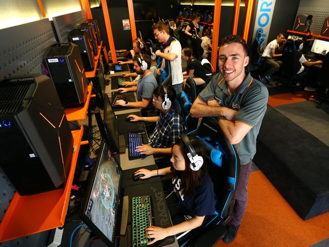 QUT eSports co-founder Dylan Poulus in the university’s gaming arena. Picture: Adam Head