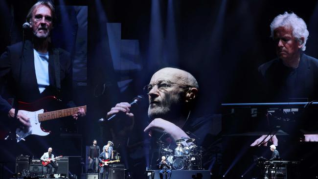 Mike Rutherford (left), Phil Collins (centre) and Tony Banks (right) at the end of Genesis’s last ever concert on Saturday night. Picture: Thomas Coex / AFP.