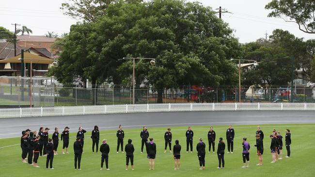 Players take part in a barefoot ceremony before a WBBL game between the Perth Scorchers and Hobart Hurricanes at Hurstville Oval