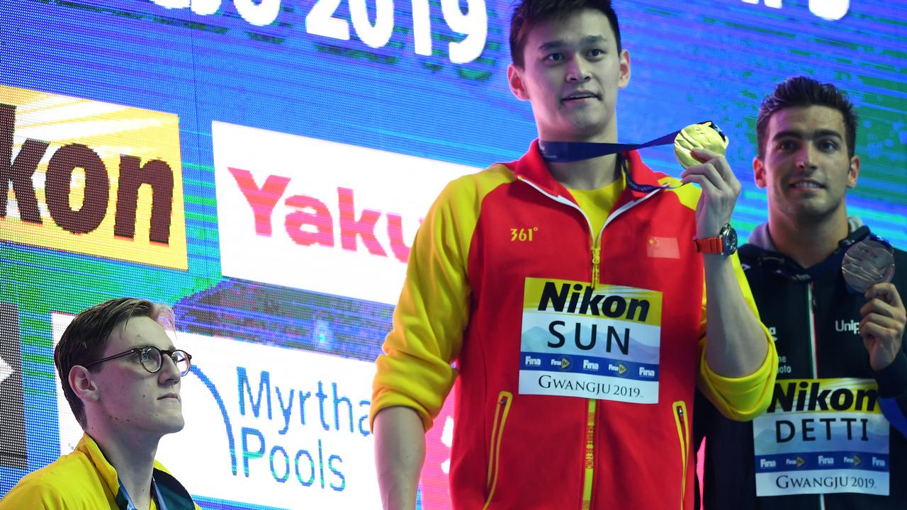 Mack Horton refuses to pose for photos on the podium with gold medallist Sun Yang and bronze medallist Gabriele Detti.