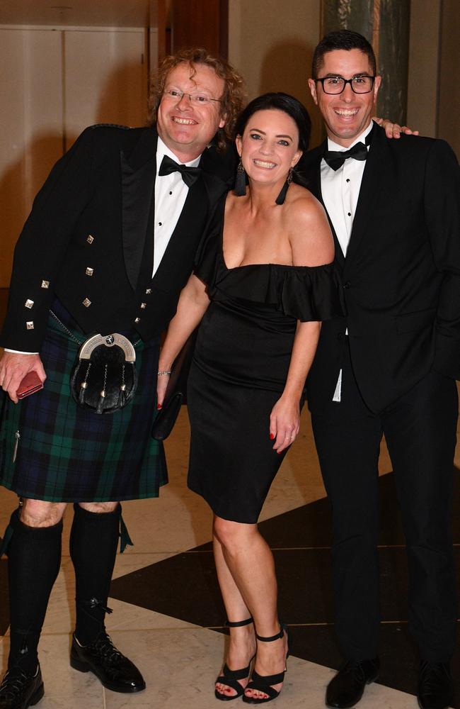 Emma Husar at the ball with James Jeffrey and Cam Sinclair. Picture: AAP