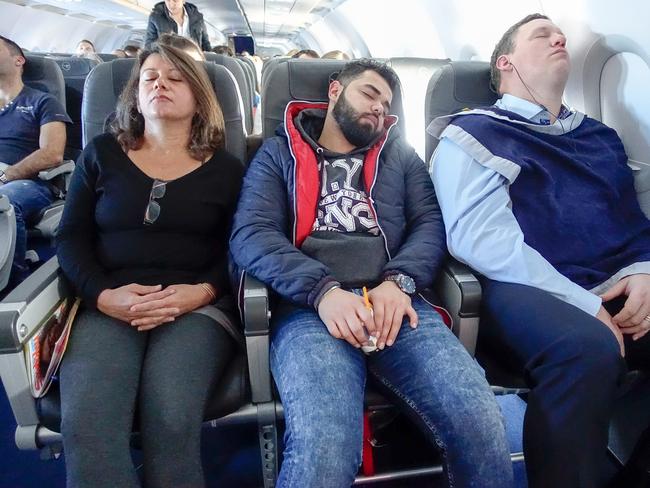 Stockholm, Sweden May 2018 passengers sleeping on a plane.