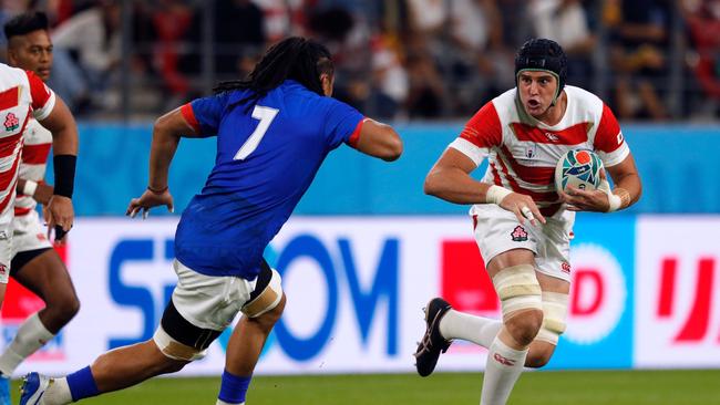 There’s nothing ‘wimpie’ about this fella.... Japan's lock Wimpie van der Walt (R) runs the ball. Picture: AFP