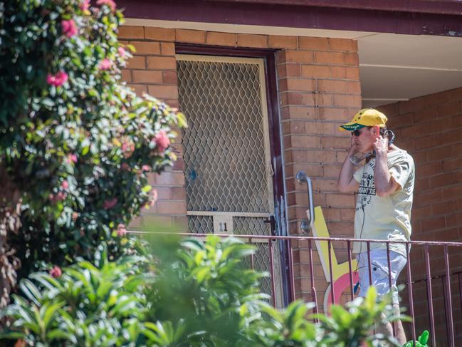 A man with headphones arrives at the unit last month. Picture: Jason Edwards