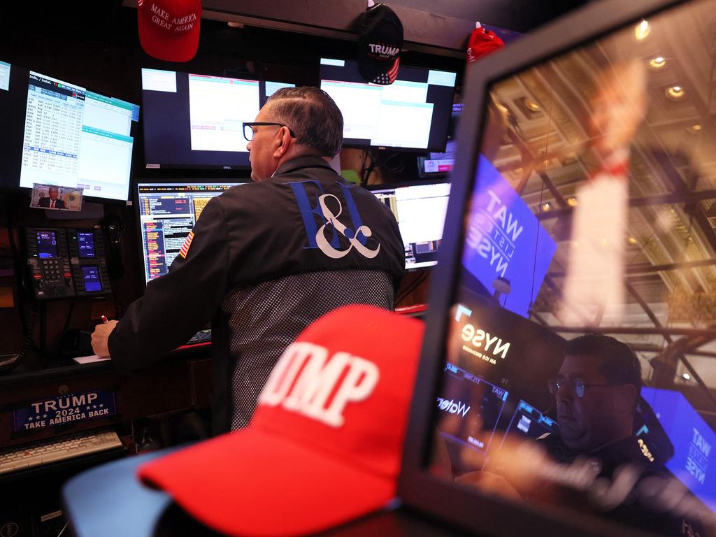 Traders work on the floor of the New York Stock Exchange. Stocks continued a downward trend after Mr Trump’s steep tariffs were imposed triggering recession fears. Picture: AFP