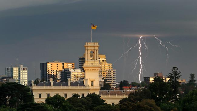 Lightning strikes over Government House as a storm crosses Melbourne. Picture: Mark Stewart