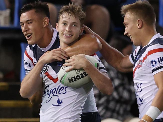 NEWCASTLE, AUSTRALIA - MAY 01: Sam Walker of the Rooster celebrates his try with team mates during the round eight NRL match between the Newcastle Knights and the Sydney Roosters at McDonald Jones Stadium, on May 01, 2021, in Newcastle, Australia. (Photo by Ashley Feder/Getty Images)