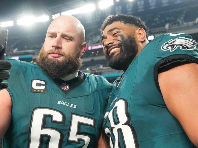 PHILADELPHIA, PENNSYLVANIA - JANUARY 12: Lane Johnson #65 and Jordan Mailata #68 of the Philadelphia Eagles take a selfie after the game against the Green Bay Packers during the NFC Wild Card Playoff at Lincoln Financial Field on January 12, 2025 in Philadelphia, Pennsylvania.   Mitchell Leff/Getty Images/AFP (Photo by Mitchell Leff / GETTY IMAGES NORTH AMERICA / Getty Images via AFP)