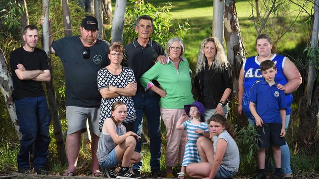 Gumeracha locals, including Phil Cornish, (former CFS captain) Brett Smyth, Ang Edwards, Hans Liedig (current captain of Gumeracha CFS) Libby Barber, Louise McDiarmid, Amy Jones with kids Mya Eglinton, 11, Lara Bogers, 18 months, Hannah Jones, 11, and Jayden Jones, 9, are fighting the State Government over the replacement of a broken siren. Picture: Naomi Jellicoe