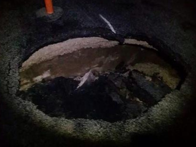 Is it a sinkhole or just a rather large pothole?