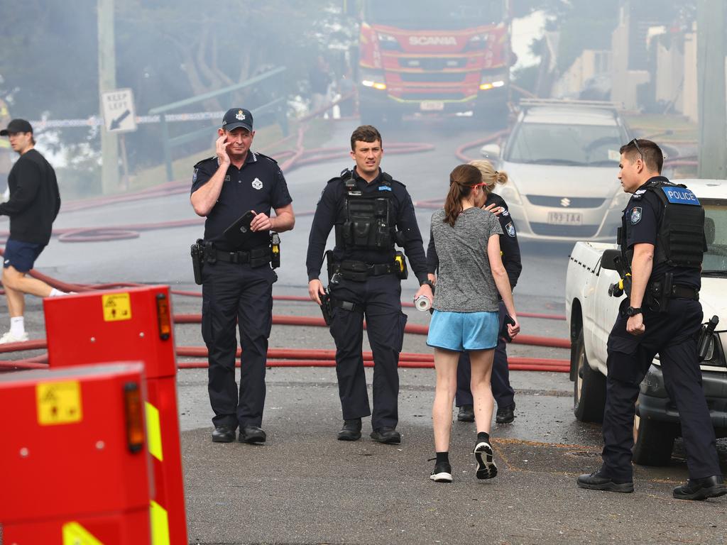 Fire crews are battling multiple house fires in Evelyn Street in Grange. Photo: David Clark.