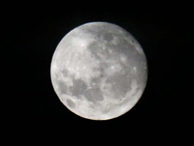 Generic images of the Moon taken from Olympic Park Sydney between cloud cover. Pics Bill Hearne