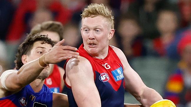 MELBOURNE, AUSTRALIA - APRIL 11: Clayton Oliver of the Demons is tackled by Jarrod Berry of the Lions during the 2024 AFL Round 05 match between the Melbourne Demons and the Brisbane Lions at the Melbourne Cricket Ground on April 11, 2024 in Melbourne, Australia. (Photo by Michael Willson/AFL Photos via Getty Images)