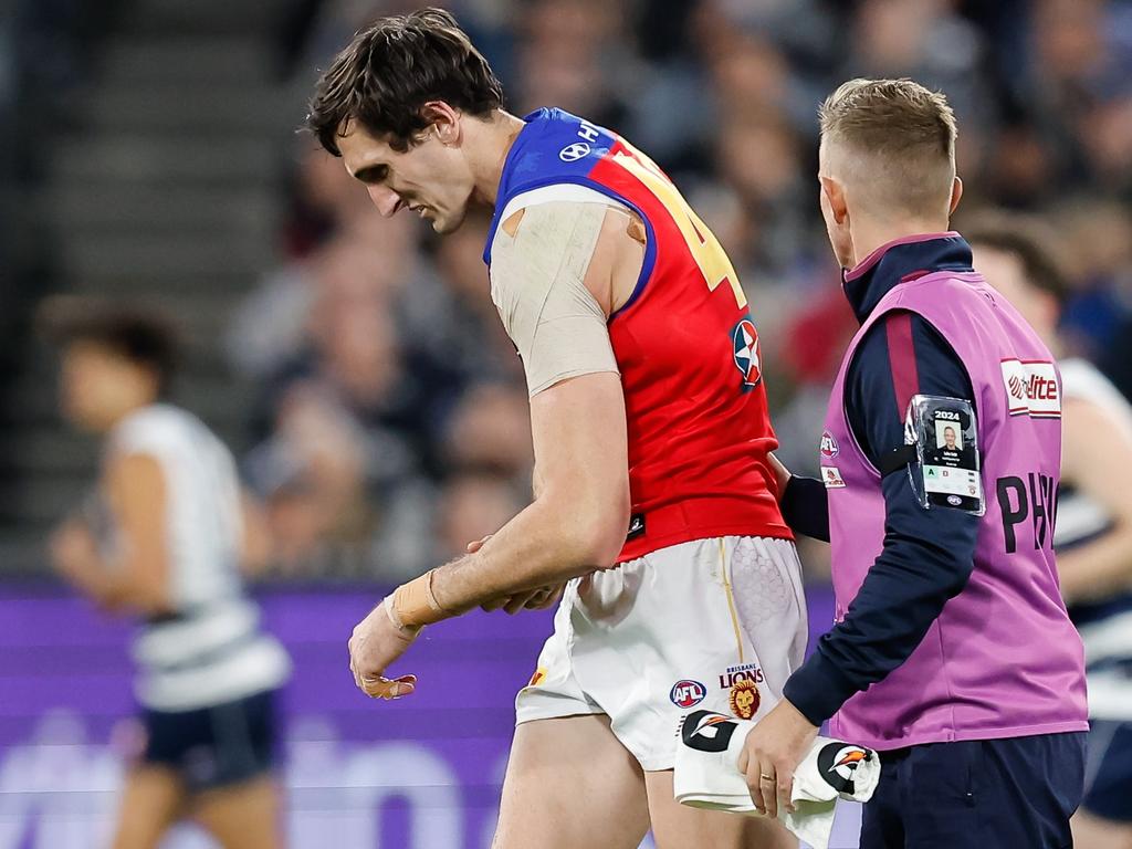 Oscar McInerney is helped from the field after dislocating his shoulder for the second time in Brisbane’s preliminary final win over Geelong. Picture: Dylan Burns/AFL Photos via Getty Images