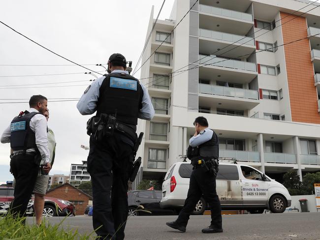 Australian Federal Police raid an apartment in Lidcombe in relation to the alleged fraud. Picture: Toby Zerna