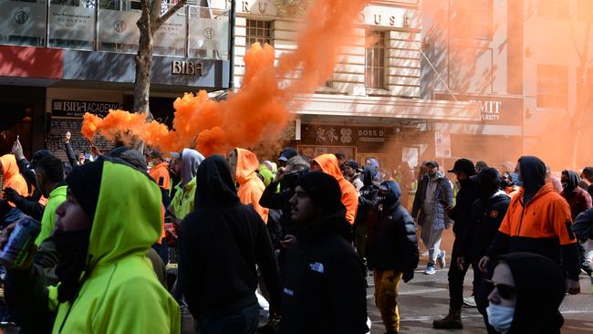 Protesters walk through central Melbourne. Picture: Andrew Henshaw