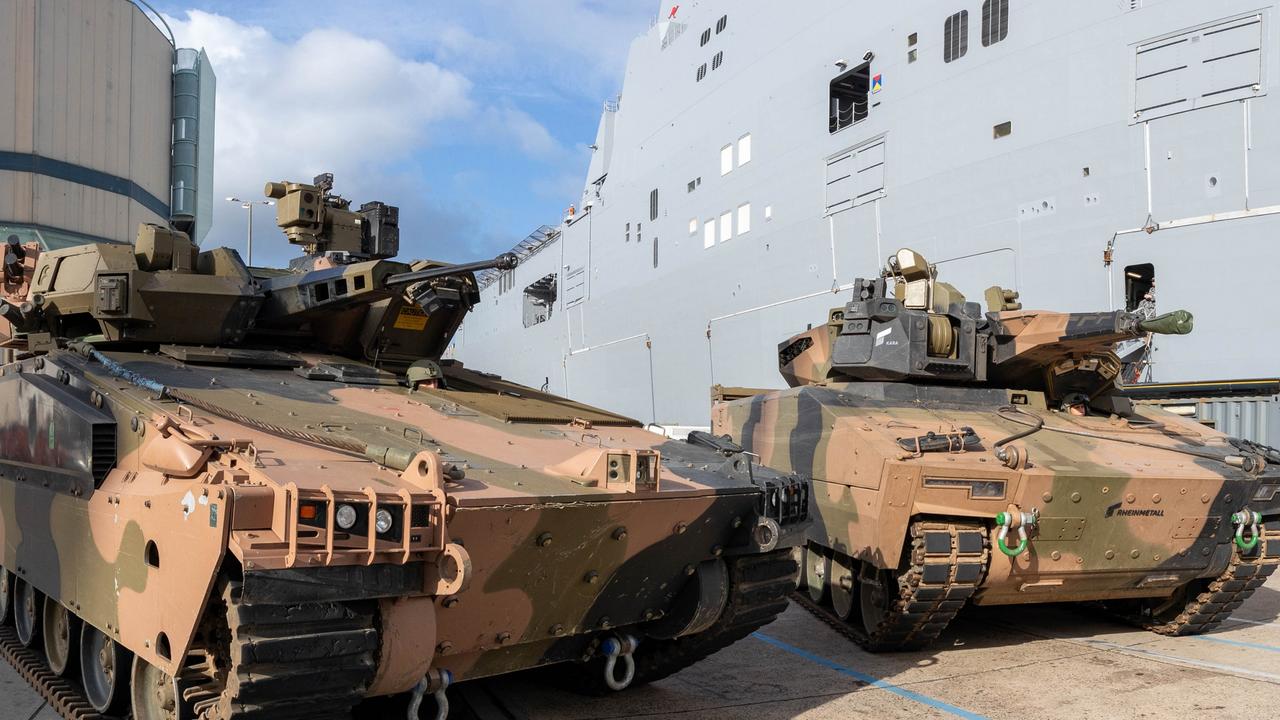 Australian Army Infantry Fighting Vehicles, Hanwha Defense Australia Redback (left) and the Rheinmetall Defence Australia KF-41 Lynx, stand ready to board HMAS Adelaide at HMAS Kuttabul, NSW for sea transportability trials.